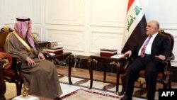 A handout picture released by the Iraqi Prime Minister's press office on February 25, 2017, shows Iraqi Prime Minister Haider al-Abadi (R) meeting with Saudi Foreign Minister Adel al-Jubeir in Baghdad.
