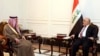伊拉克总理新闻办公室2017年2月25日发布的图片显示，伊拉克总理阿巴迪（右）同沙特外交大臣朱拜尔在巴格达举行会晤。