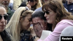 A protester cries during an anti-bailout rally by employees of Cyprus Popular Bank, outside parliament, Nicosia, March 22, 2013.