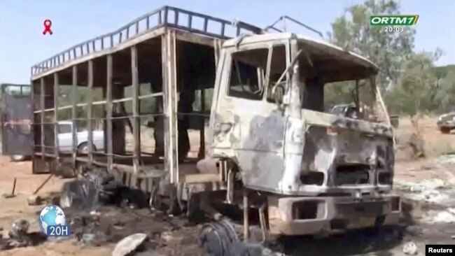 A burnt bus is seen following a gunmen attack near Bankass, Mali on Dec. 4, 2021 in this still image obtained from a video.