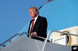 President Donald Trump steps off Air Force One as he arrives April 9, 2017, at Andrews Air Force Base, Maryland.