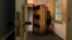 FILE- A woman enters the secret annex at the renovated Anne Frank House Museum in Amsterdam, Netherlands, Nov. 21, 2018.