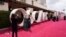 Celebrities and guests walk the red carpet at the Oscars in Los Angeles, California, April 25, 2021.