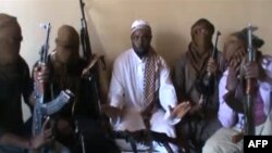 File - Boko Haram leader Abubakar Shekau, center, flanked by militants in April 2012 screengrab image (AFP Photo/YouTube).