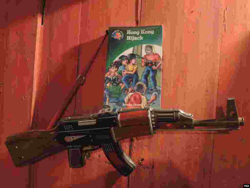 A collectible toy gun from Hong Kong is displayed in Ms. Koo's bookstore and cafe in Tainan City, Taiwan. (Iris Tong/VOA) 
