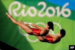 China's Liu Huixia and Chen Ruolin compete during the women's synchronized 10-meter platform diving final in the Maria Lenk Aquatic Center at the 2016 Summer Olympics in Rio de Janeiro, Brazil, Aug. 9, 2016.
