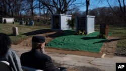 FILE - University of Pennsylvania's Penn Museum hosts an interfaith burial service for 19 unidentified Black Philadelphians whose remains were part of a display at the museum, at Eden Cemetery on February 3, 2024, in Collingdale, Pa.