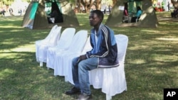 Tonderai Kanyere waits for his results after he was tested for HIV and AIDS in Harare, June 22, 2012.