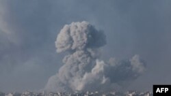 FILE - A picture taken from southern Israel near the border with the Gaza Strip on December 6, 2023, shows smoke billowing during Israeli bombardment in Gaza amid continuing battles between Israel and the Palestinian militant group Hamas.