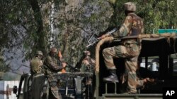 Indian soldiers guard outside the army base which was attacked Sunday by suspected militants at Uri, Indian controlled Kashmir, Sept. 19, 2016. 