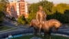 The statue of Confederate Gen. Robert E. Lee is bathed in the late sun on Monument Avenue in Richmond, Va., Sept. 6, 2021. 