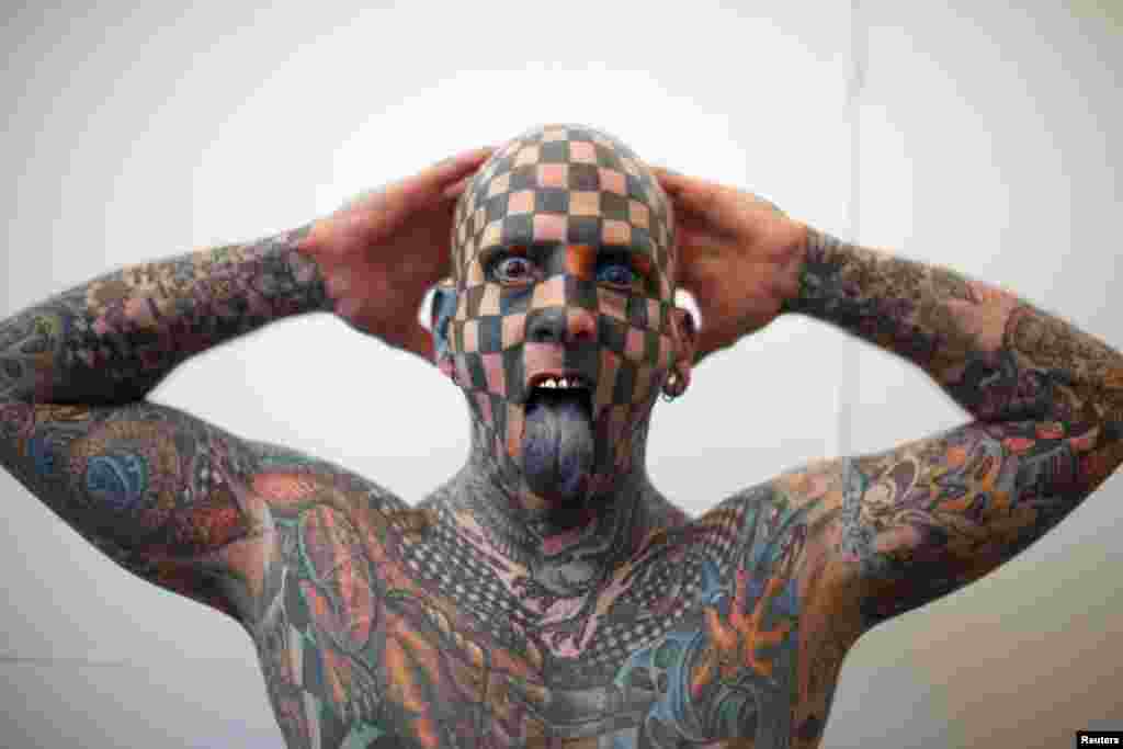 Matt Gone, the &#39;Checkered Man,&#39; poses during the Venezuela Expo Tattoo in Caracas.