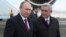 Russian President Vladimir Putin (L) walks with Armenian President Serge Sarksyan after arriving in the Armenian city of Gyumri, Dec. 2, 2013.