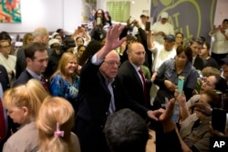 Democratic presidential candidate Sen. Bernie Sanders of Vermont waves to hotel workers at MGM Grand hotel and casino in Las Vegas, Feb. 20, 2016.