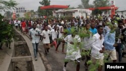 FILE - Congolese opposition supporters chant slogans during a march to press President Joseph Kabila to step down in the Democratic Republic of Congo's capital, Kinshasa, Sept. 19, 2016. 