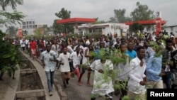 FILE - Congolese opposition supporters chant slogans during a march to press President Joseph Kabila to step down in the Democratic Republic of Congo's capital, Kinshasa, Sept. 19, 2016. 