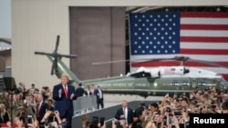 FILE - U.S. President Donald Trump visits U.S. troops based in Osan Air Base, South Korea June 30, 2019. 