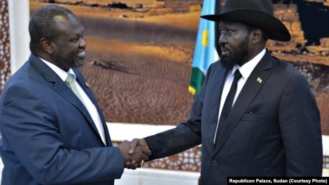 South Sudan rebel leader Riek Machar,left, shakes hands with Salva Kiir. Machar is the leader of the Sudan People’s Liberation Movement In Opposition. Kiir is leader of the Sudan People's Liberation Movement. 