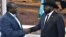 South Sudan rebel leader Riek Machar,left, shakes hands with Salva Kiir. Machar is the leader of the Sudan People’s Liberation Movement In Opposition. Kiir is leader of the Sudan People's Liberation Movement. 