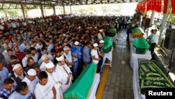 Family members and friends of victims of a suicide bombing at a wedding celebration attend their funeral ceremony in the southern Turkish city of Gaziantep, Turkey, Aug. 21, 2016.