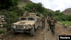 Afghan Special Forces patrol at the site of a MOAB, or ''mother of all bombs'', which struck the Achin district of the eastern province of Nangarhar, Afghanistan April 23, 2017. 