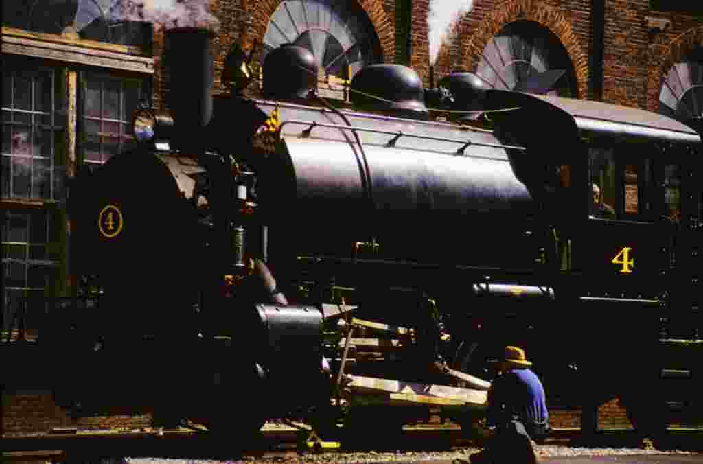 Railfan inspects a Porter 0-4-0 steam locomotive at the Baltimore and Ohio Transportation Museum.