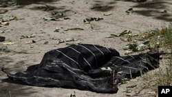 A piece of turban belonging to a suspected suicide bomber is seen inside the compound of mayor's office in Kandahar south of Kabul, Afghanistan, July 27, 2011