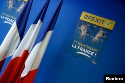 A poster reading "Brexit, And now France" is seen near French flags before a news conference at the France's far-right National Front political party headquarters in Nanterre near Paris.
