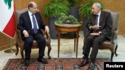 FILE - Lebanese President Michel Aoun meets with Lebanese Parliament Speaker Nabih Berri at the presidential palace in Baabda, Lebanon, Nov. 27, 2017.