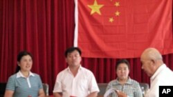 Announcing election results. Wei Xizhen and two others are elected members of the Xiwangping Villagers' Committee