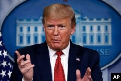 FILE - President Donald Trump speaks about the coronavirus in the James Brady Press Briefing Room of the White House, April 16, 2020, in Washington.
