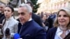 FILE - Calin Georgescu and his wife Cristela Georgescu arrive at the Central Electoral Bureau where Georgescu submitted his candidacy for the May presidential ballot re-run, in Bucharest, March 7, 2025. Inquam (Inquam Photos/Octav Ganea via Reuters) 