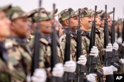 FILE—Members of the Moroccan Royal Armed Forces stand guard as they take part in the 20th edition of the African Lion military exercise, in Tantan, south of Agadir, Morocco, May 31, 2024.