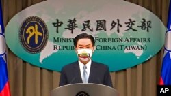 FILE - Taiwan Foreign Minister Joseph Wu speaks about exchanging representative offices with Lithuania during a press briefing in Taipei, Taiwan, July 20, 2021, in this image taken from video.