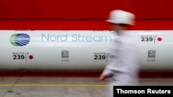 FILE - The logo of the Nord Stream 2 gas pipeline project is seen on a pipe at the Chelyabinsk pipe rolling plant in Chelyabinsk, Russia, February 26, 2020.