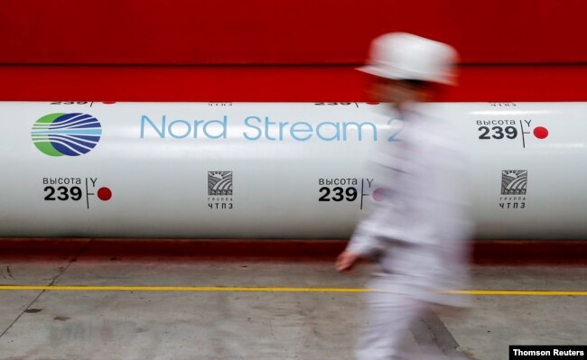 FILE - The logo of the Nord Stream 2 gas pipeline project is seen on a pipe at the Chelyabinsk pipe rolling plant in Chelyabinsk, Russia, Feb. 26, 2020.