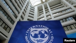 FILE - The International Monetary Fund logo is seen during the IMF/World Bank spring meetings in Washington in 2017.