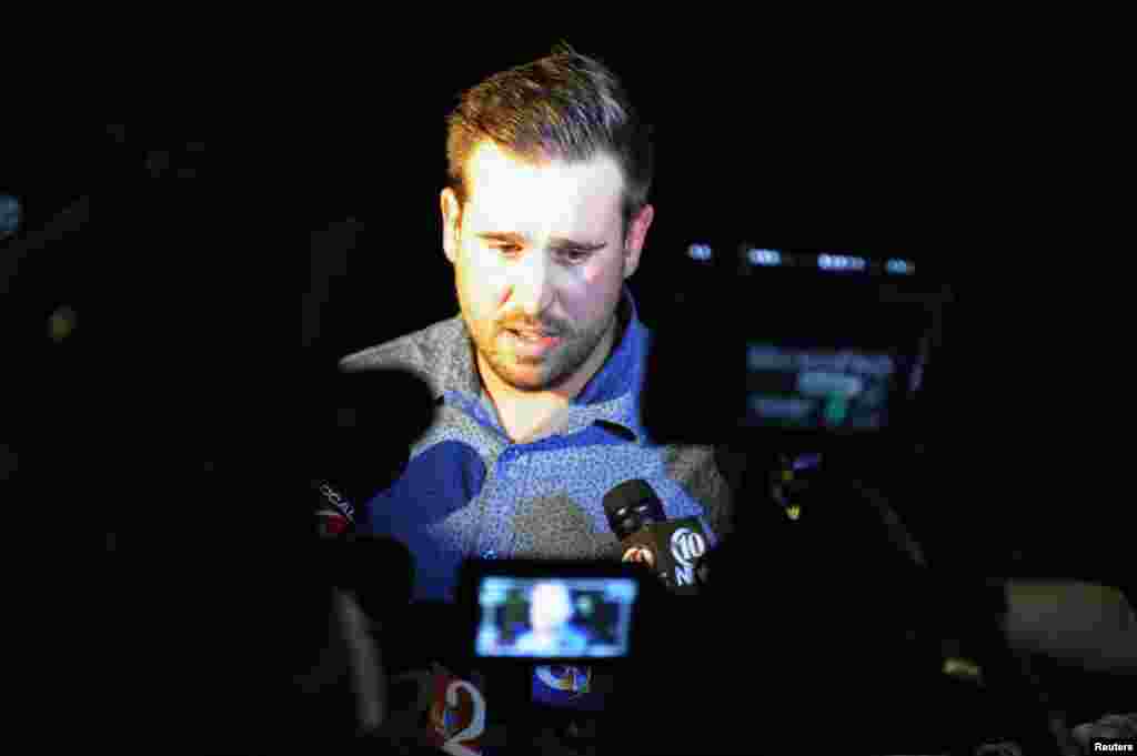 Chris Nault, who says he is a former rugby teammate of U.S. journalist Steven Sotloff, speaks with reporters during a vigil for Sotloff at the Reflection Pool on the campus of the University of Central Florida in Orlando, Florida, Sept. 3, 2014.