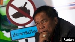 FILE - Kwanchai Praipana, a pro-government "red shirt" leader, is seen during an interview with Reuters at a radio station he owns in Udon Thani, Jan. 21, 2014.