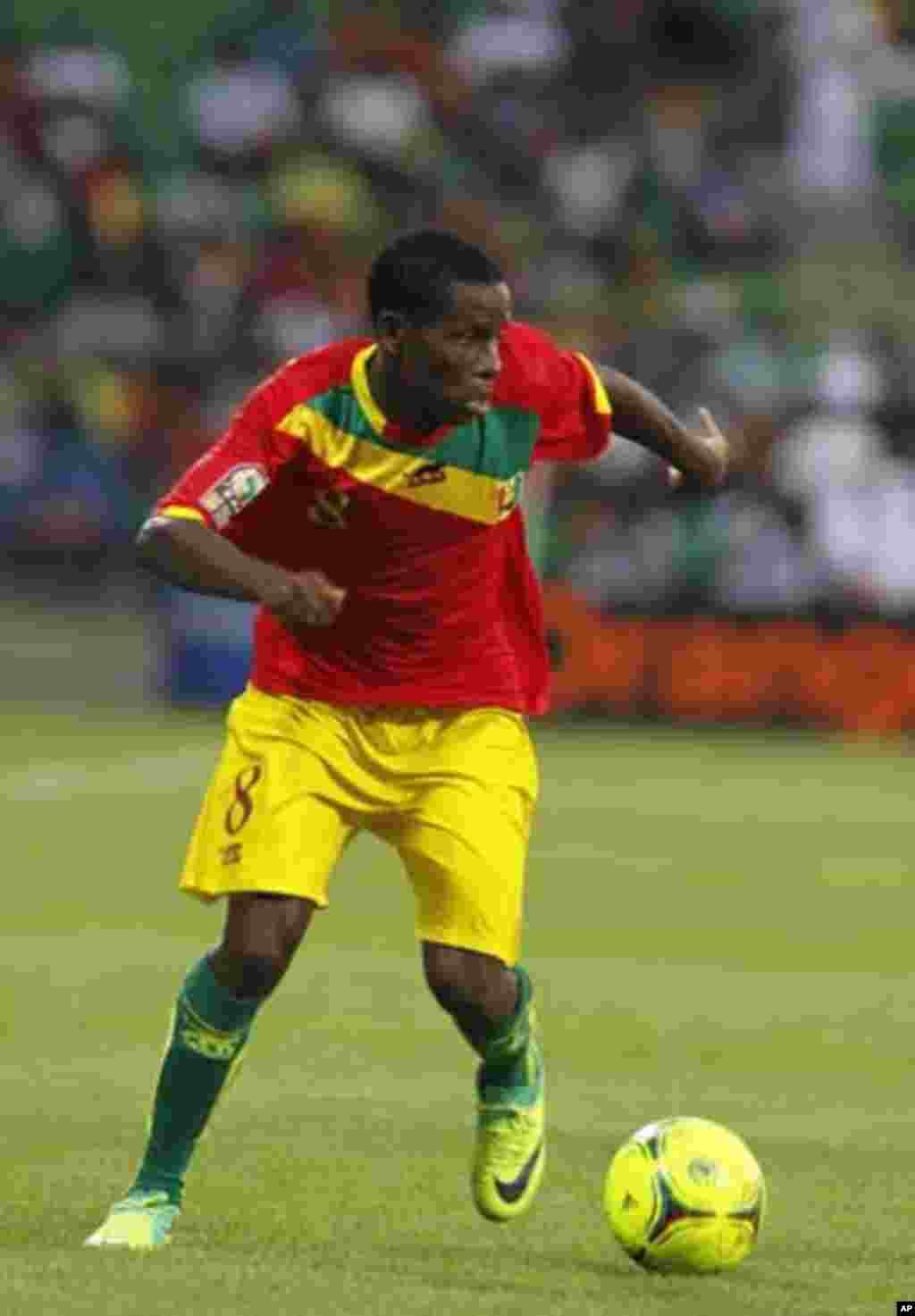 Guinea's Ibrahim Traore runs with the ball during their African Nations Cup Group D soccer match against Botswana at Franceville Stadium January 28, 2012.