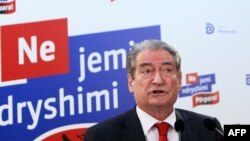 FILE - Albania's then-Prime Minister Sali Berisha speaks during a press conference in Tirana, June 26, 2013. 