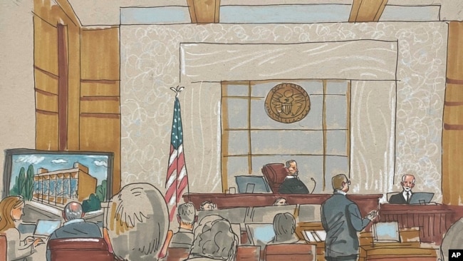 In this courtroom sketch, prosecuting attorney Eric G. Olshan questions witness Rabbi Jeffrey Myers of the Tree of Life Congregation, in the federal trial for 2018 synagogue massacre suspect Robert Bowers, May 30, 2023, in Pittsburgh.