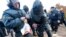 Riot police detain an anti-gay protester during an authorized gay rights rally in St. Petersburg, Russia.  A gay rights rally has ended in scuffles after several dozen protesters were confronted by about 200 conservative and religious activists. 