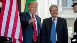 President Donald Trump greets Italian Prime Minister Paolo Gentiloni as he arrives at the West Wing of the White House in Washington, April 20, 2017.