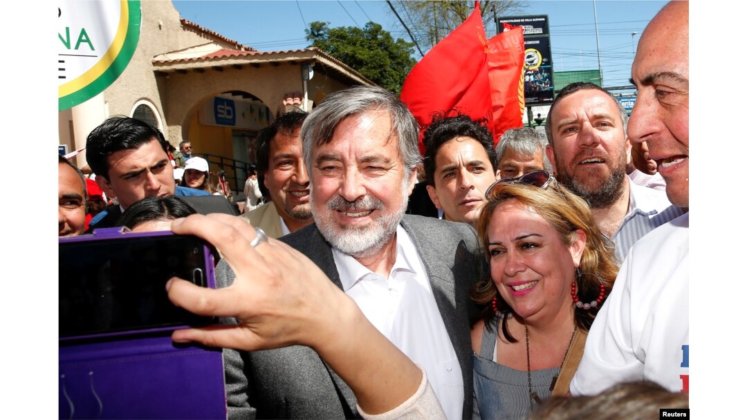 FILE - Center-left Chilean senator and presidential candidate Alejandro Guillier takes part in a campaign rally ahead of the next presidential election in November 2017, in Villa Alemana, Valparaiso, Chile, Oct. 10, 2017.