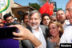 FILE - Center-left Chilean senator and presidential candidate Alejandro Guillier takes part in a campaign rally ahead of the next presidential election in November 2017, in Villa Alemana, Valparaiso, Chile, Oct. 10, 2017.