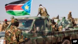 South Sudanese government soldier in Unity State, South Sudan, Sunday, Jan 12, 2014. A government official says an unspecified number of SPLA soldiers have been detained on suspicion they carried out targeted ethnic killings. 