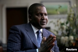 Aliko Dangote , founder and CEO of the Dangote Group, gestures during an interview in his office in Lagos, Nigeria, June 13, 2012.