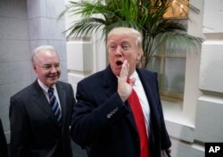 FILE - President Donald Trump and Health and Human Services Secretary Tom Price arrive on Capitol Hill in Washington, March 21, 2017.