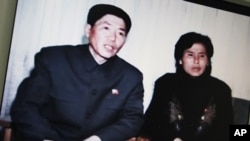 Screen shot of a N. Korea state website shows a video of an interview with N. Korean family who drifted into S. Korean waters aboard a fishing vessel last month, in Seoul, March 9, 2011